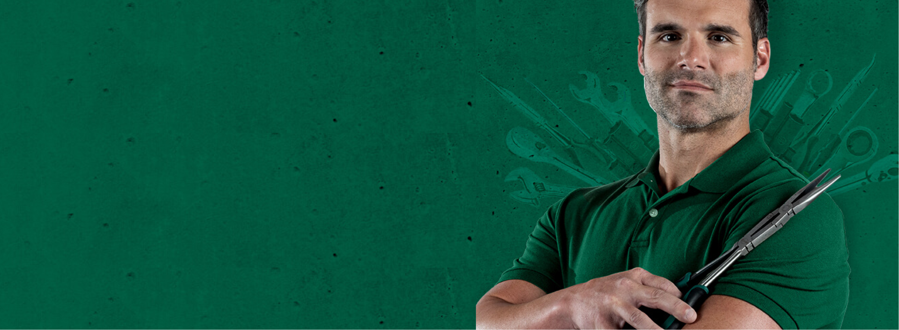 SATA-Mechanic man in green shirt holding wrench