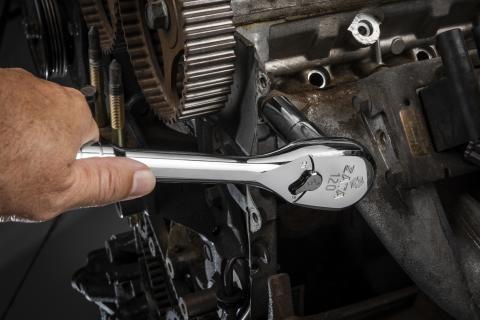 man using wrench